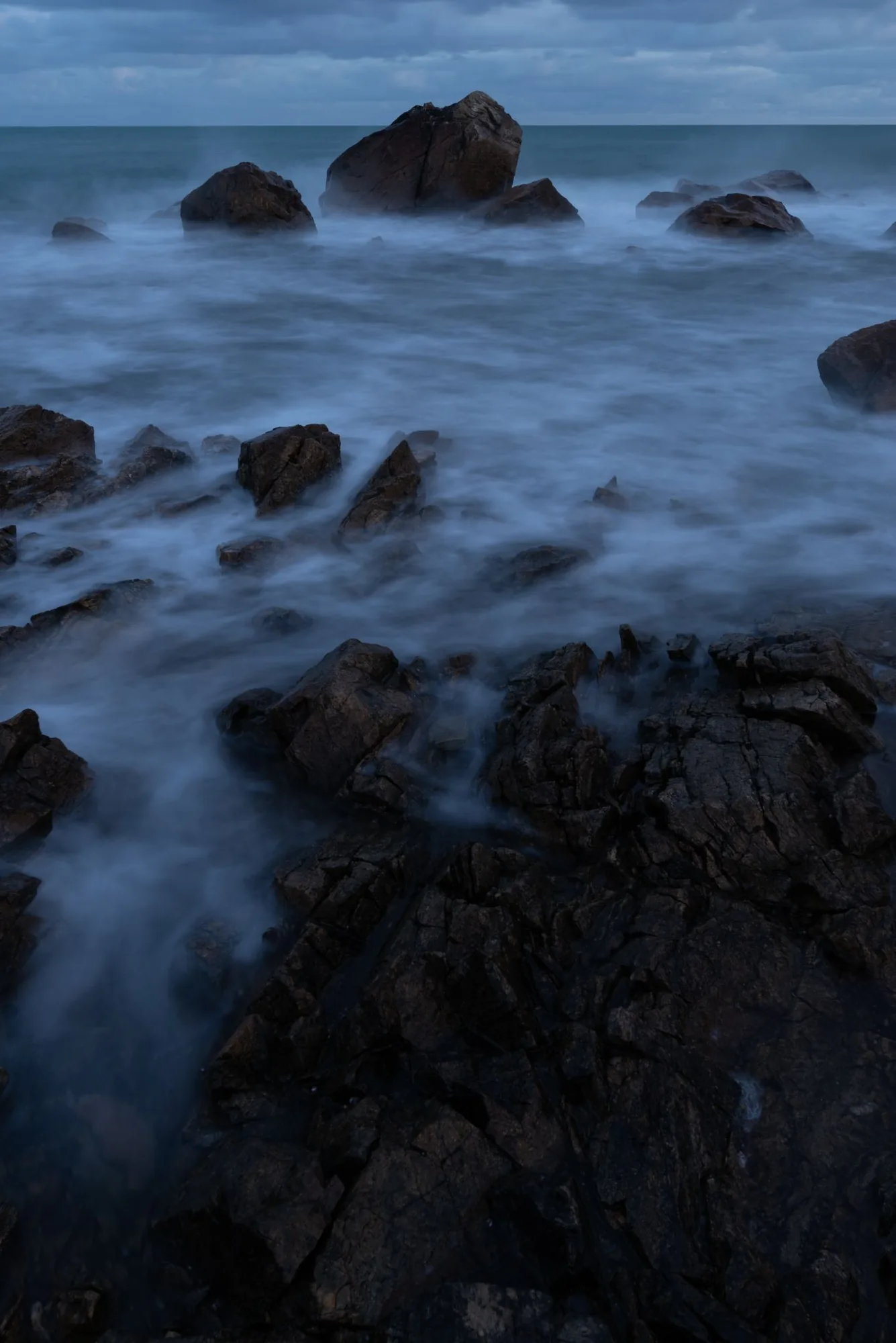 Reviving the colors of a gloomy seascape: before, after light retouching, and after heavy retouching — RAW