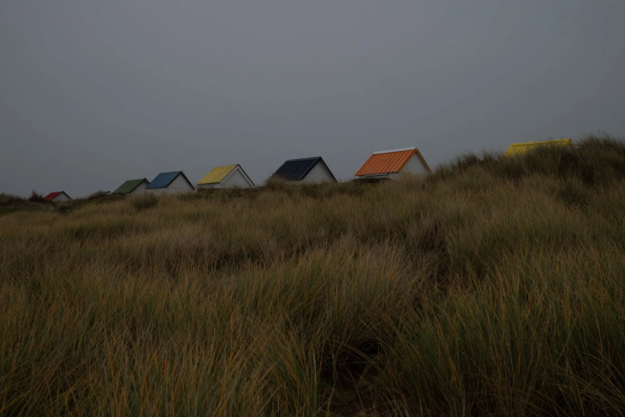 Bringing vibrant color to a seaside scene: beach cabins before and after retouching — FINAL